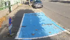 a disabled parking space with traffic sign