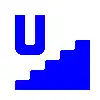 Идея: Лестница, выходящая на поверхность из подземного пространства. U означает подземный (underground), каким бы не был объект под поверхностью земли. В настоящее время нет окончательного решения по использованию этого символа.