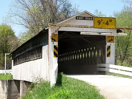 United States (Ohio): name=Root Road Covered Bridge On the roadway: bridge:name=Root Road Covered Bridge lanes=1 maxheight=9'4" maxheight:conditional=9'4" @ (width<6'); 8'2" @ (width>=6')