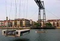 A trainera under the transporter Bizkaia Bridge.