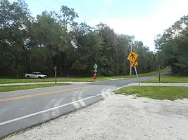 United States (Florida): No vehicular signals. No pedestrian signals. No road markings. crossing:signals=no crossing:markings=no