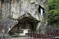 A lourdes grotto built in a real cliff face in Yvoir, Belgium